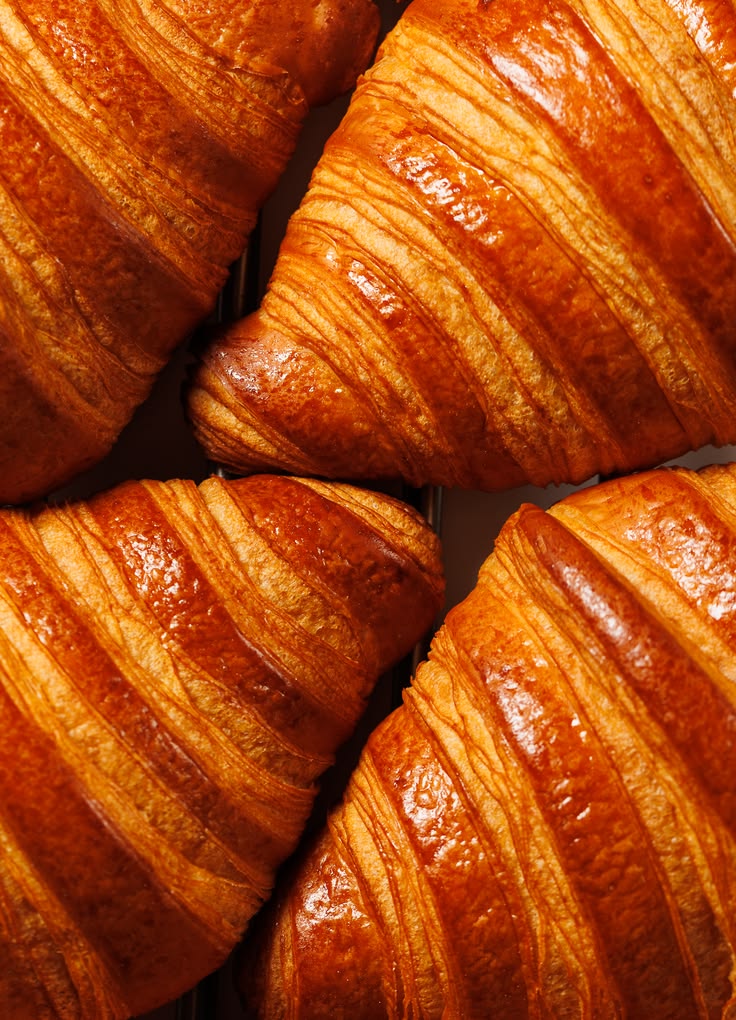 Golden-baked croissants grouped together